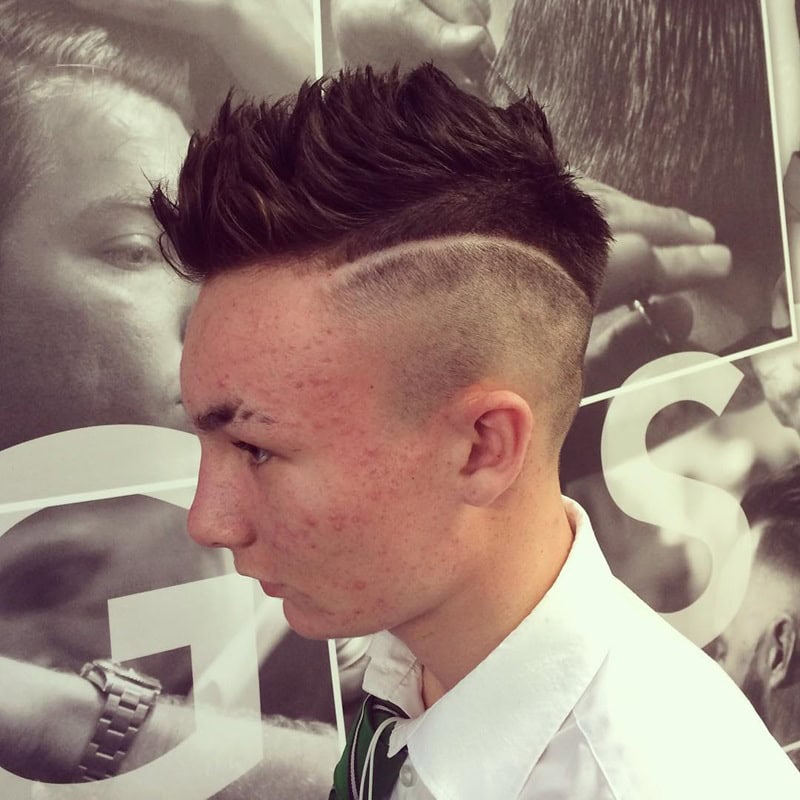 spiky textured hair with curved hard part