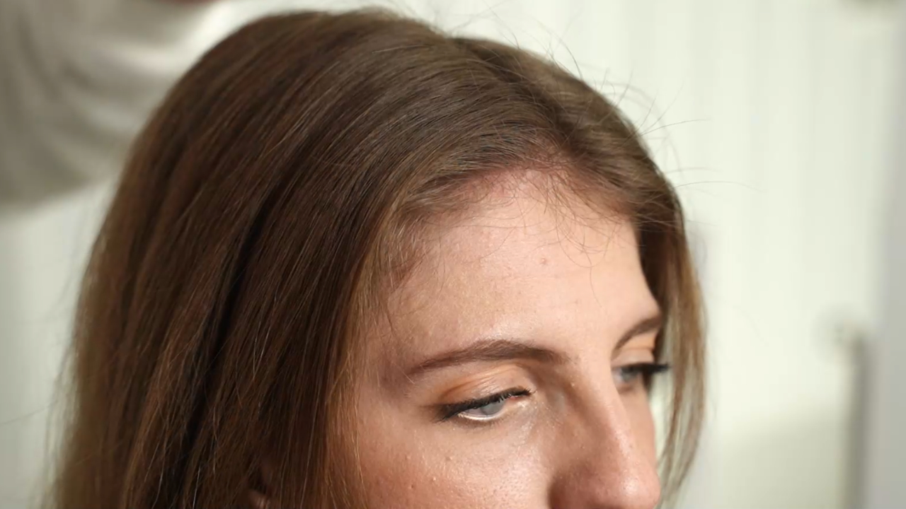 Close-up of a clean center part with smooth roots.