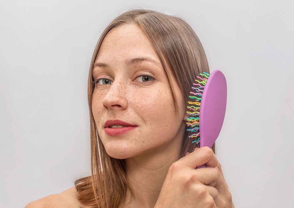 Thin Hair Mistakes to Avoid - brushing wet hair