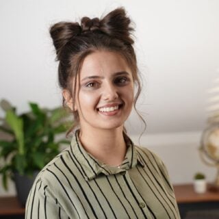 Front view of an upside-down Dutch braid finished with a big hair bow on top