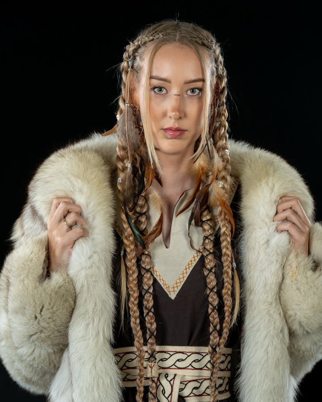 viking braided hairstyle featuring twin long pigtail braids