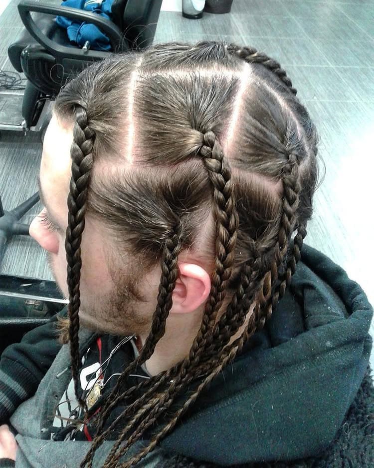 White man's long hair styled into box braids featuring large, distinct square parts on the scalp.