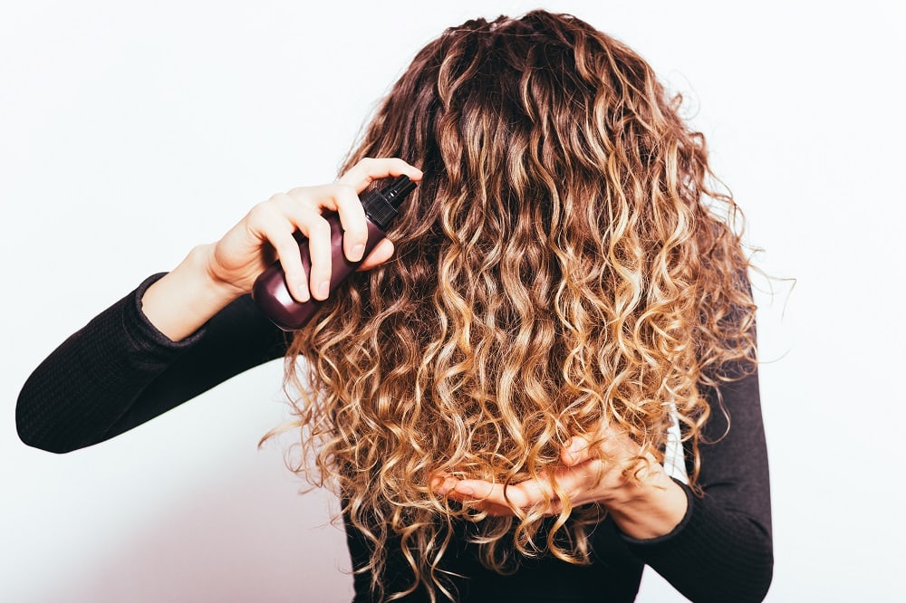 Why natural curls fall flat - using too many products