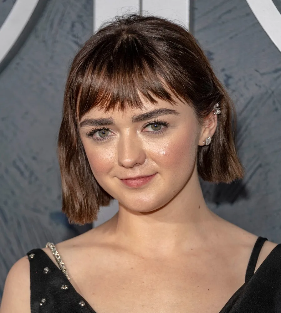 Young actress with brown hair and green eyes - Maisie Williams