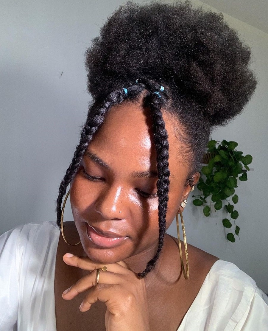 afro puff hairstyle with accent braids