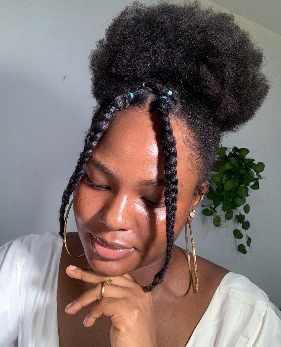 Afro puff hairstyle with accent braids