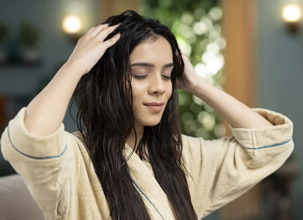 applying coconut oil before shampoo