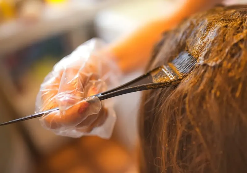 applying henna hair dye