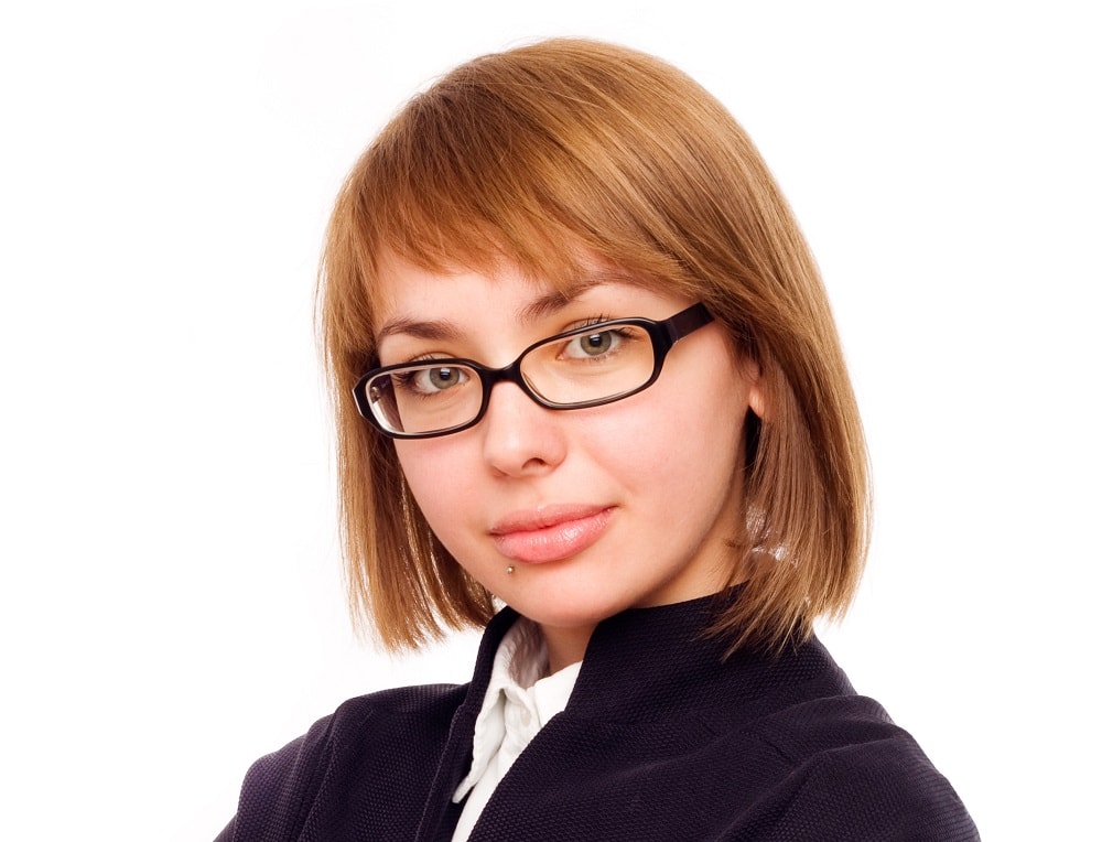 asymmetrical bangs for round faces with glasses