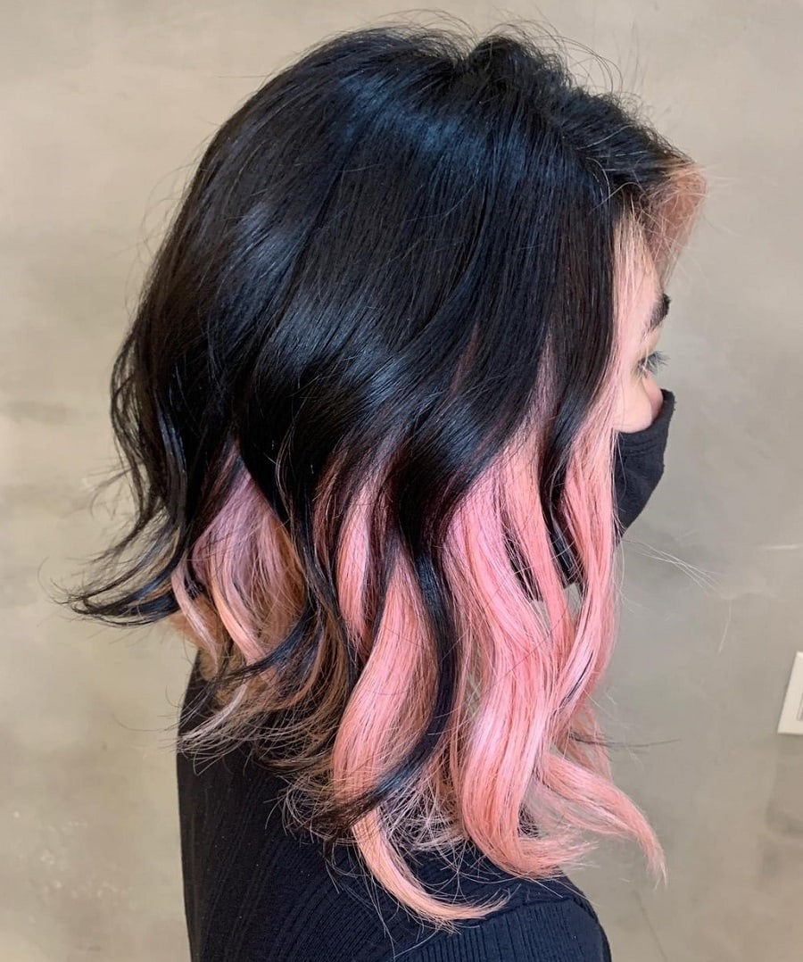 asymmetrical black hair with pink underneath