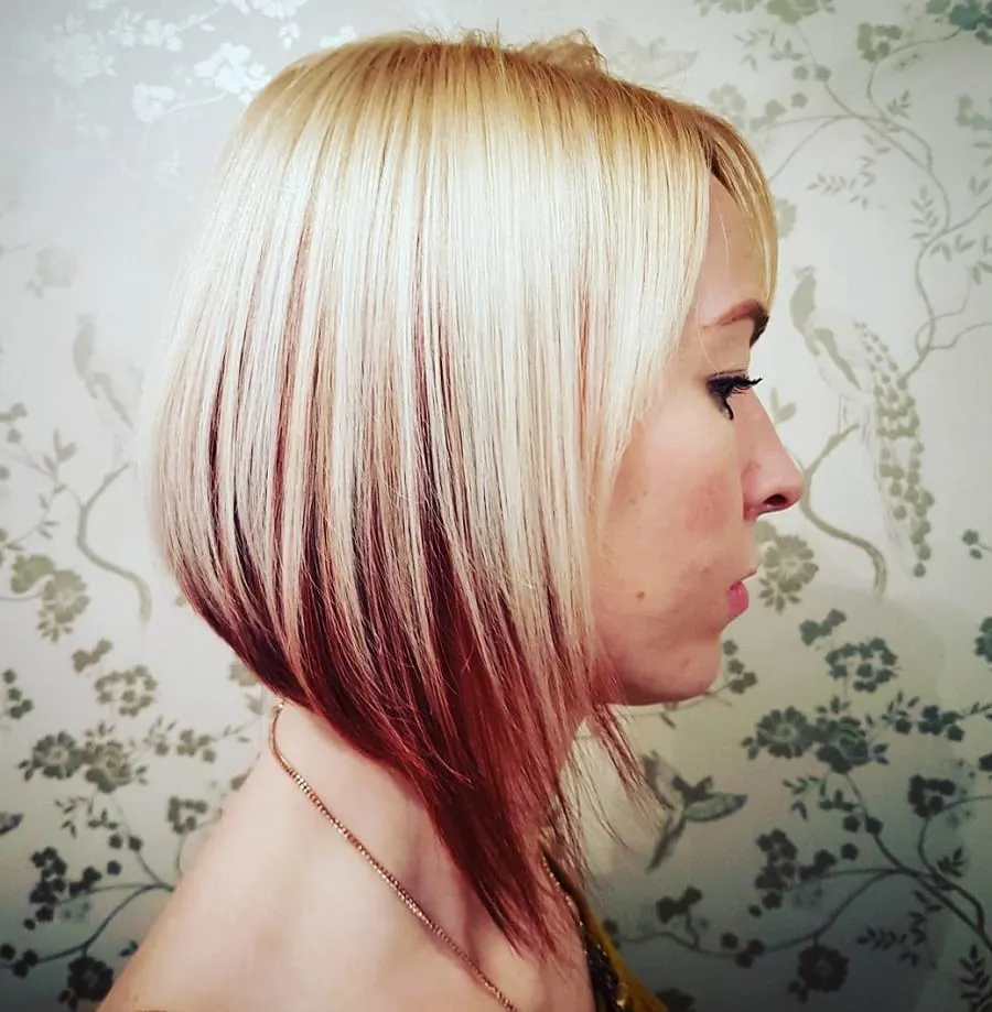 asymmetrical blonde bob with red underneath