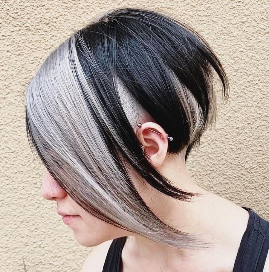 asymmetrical cut with skunk stripe hair