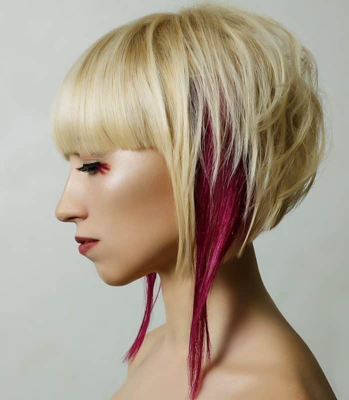 asymmetrical haircut with pink hair streaks