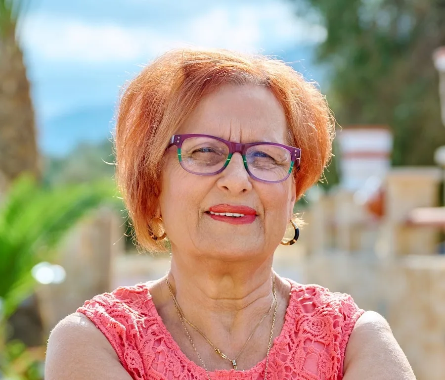 asymmetrical short hairstyle for over 70 with glasses