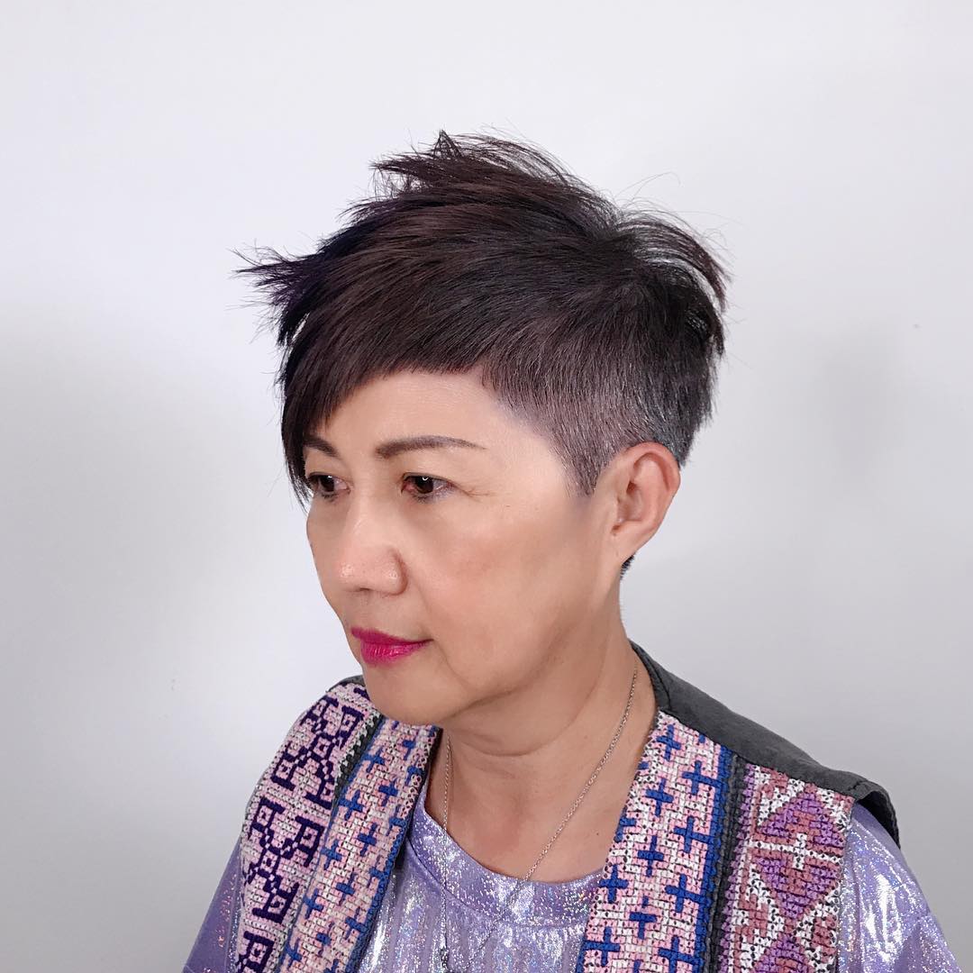 Asian woman with an asymmetrical spiky pixie haircut and tapered sides