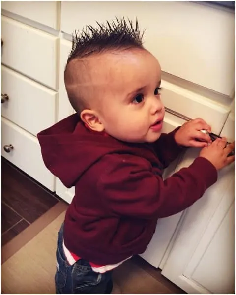 baby boy's first haircut with spikes