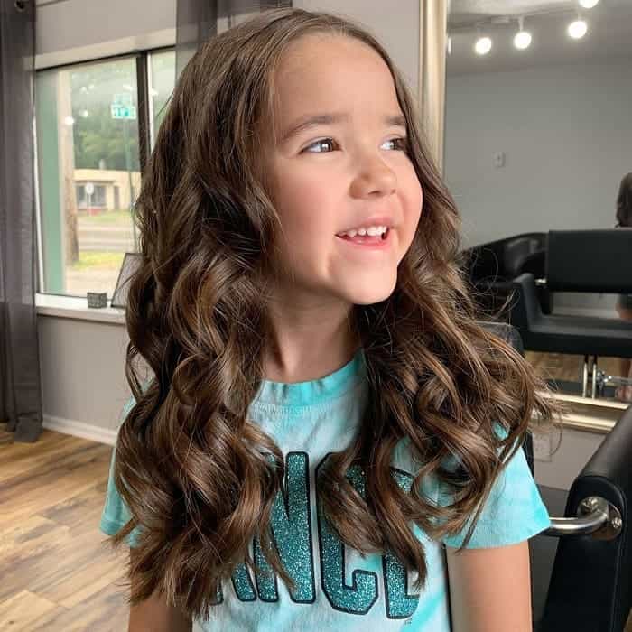 baby girl with long wavy hair