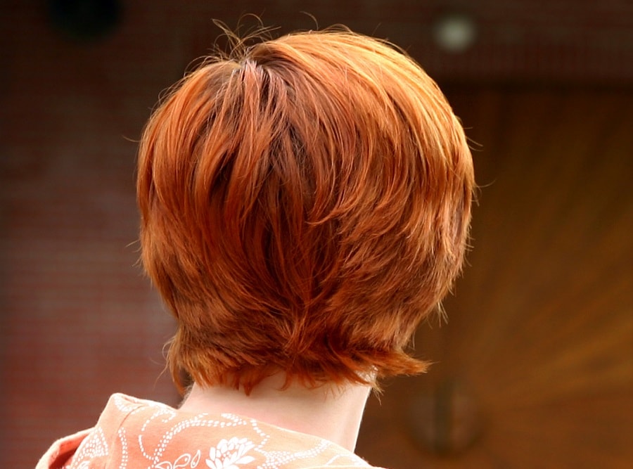 back view of short red layered hair