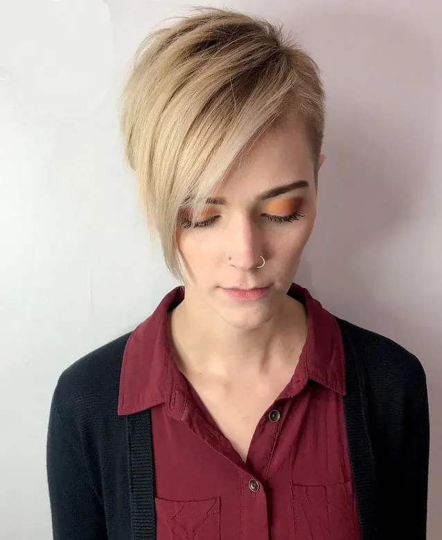 blonde balayage pixie with long bangs