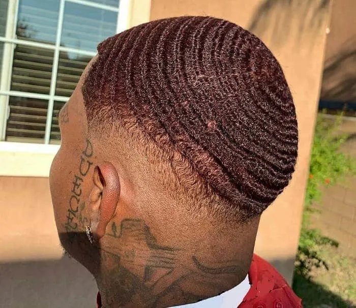low bald fade with dyed 360 waves