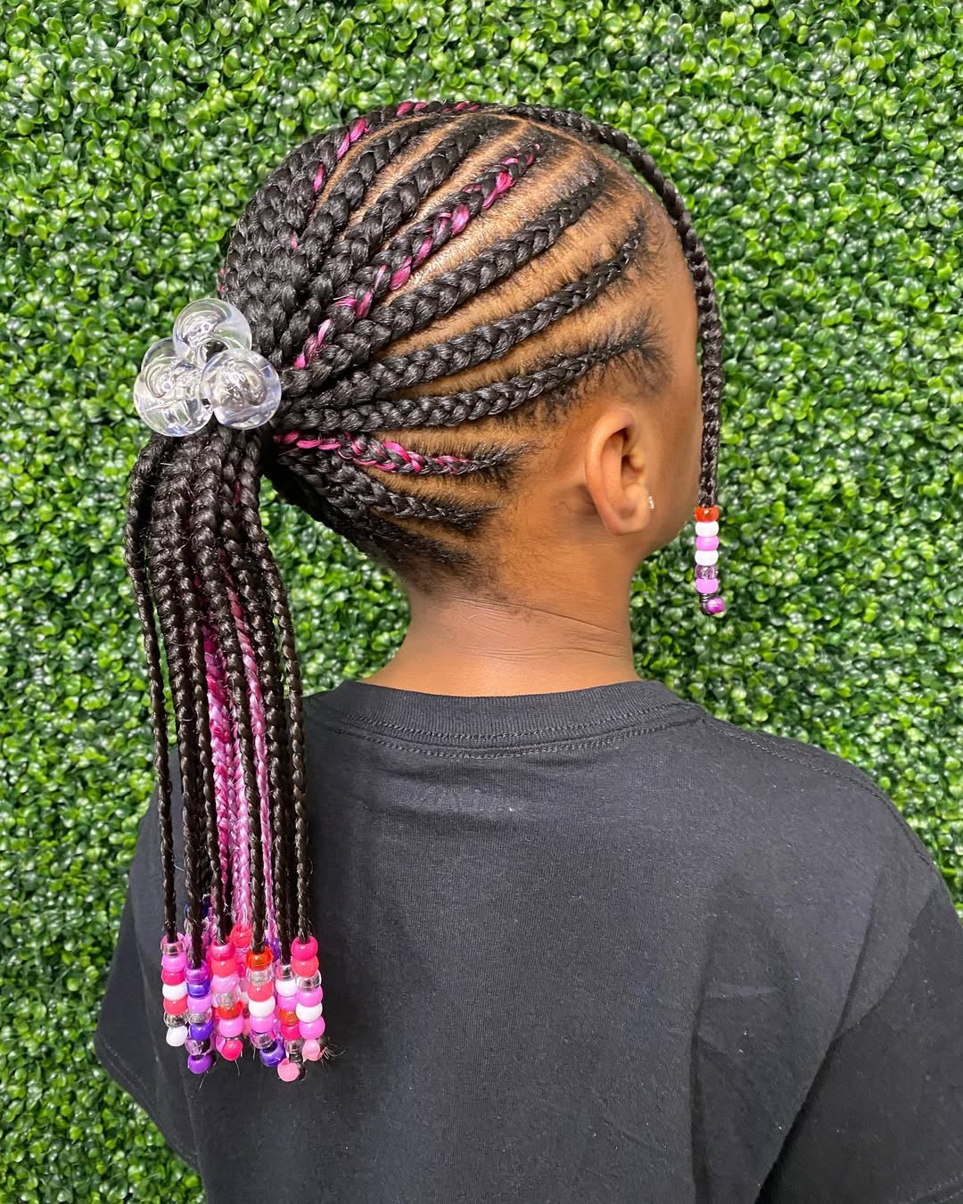 Little black girl featuring beaded cornrow ponytail