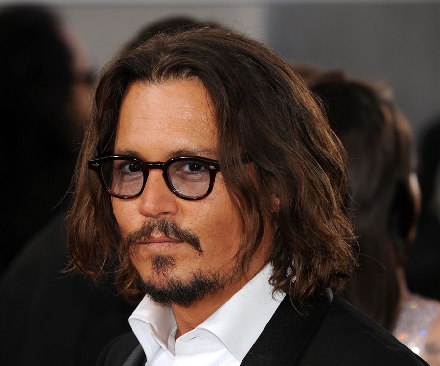 bearded celebrity Johnny Depp with glasses
