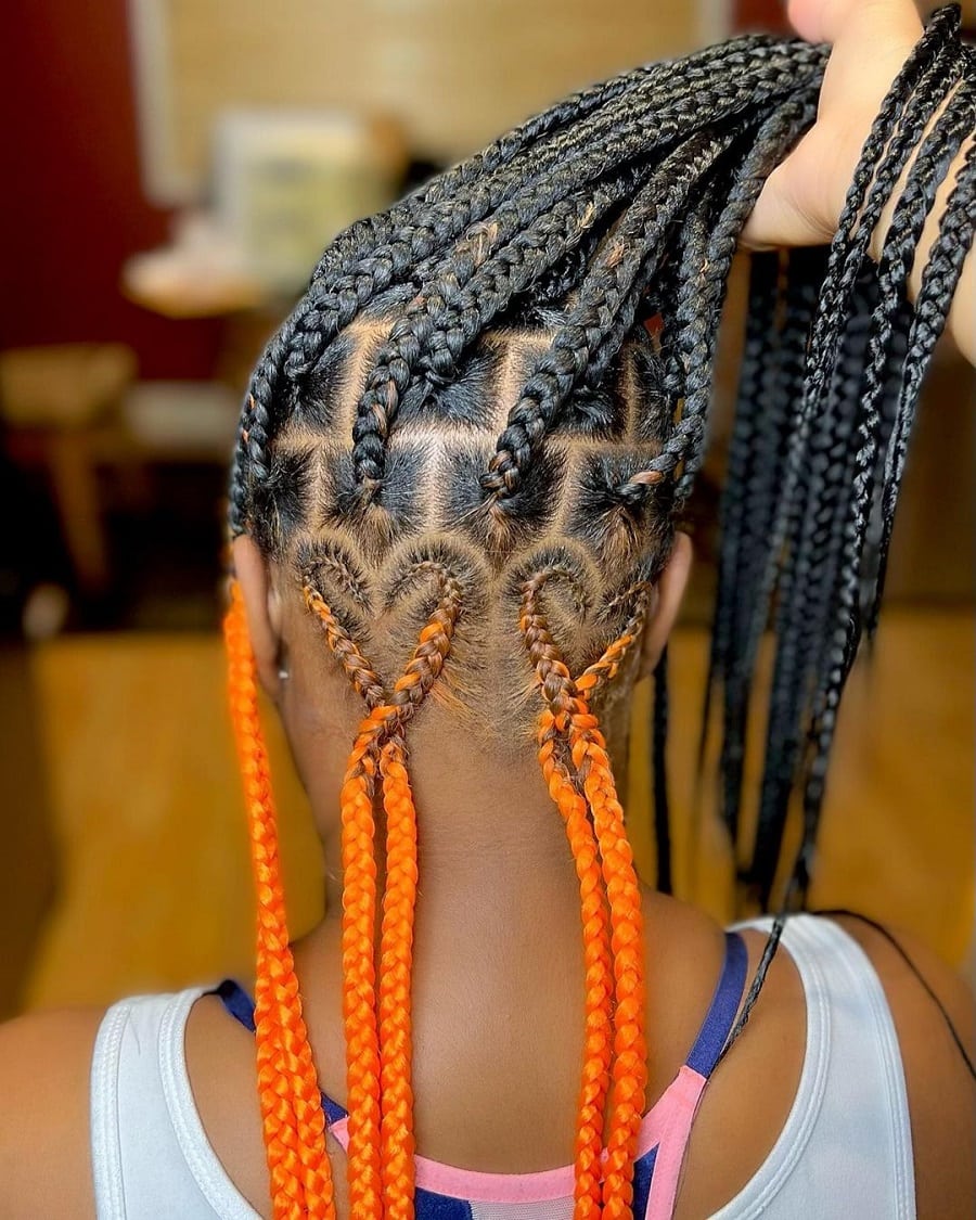 black and orange knotless braids with heart design