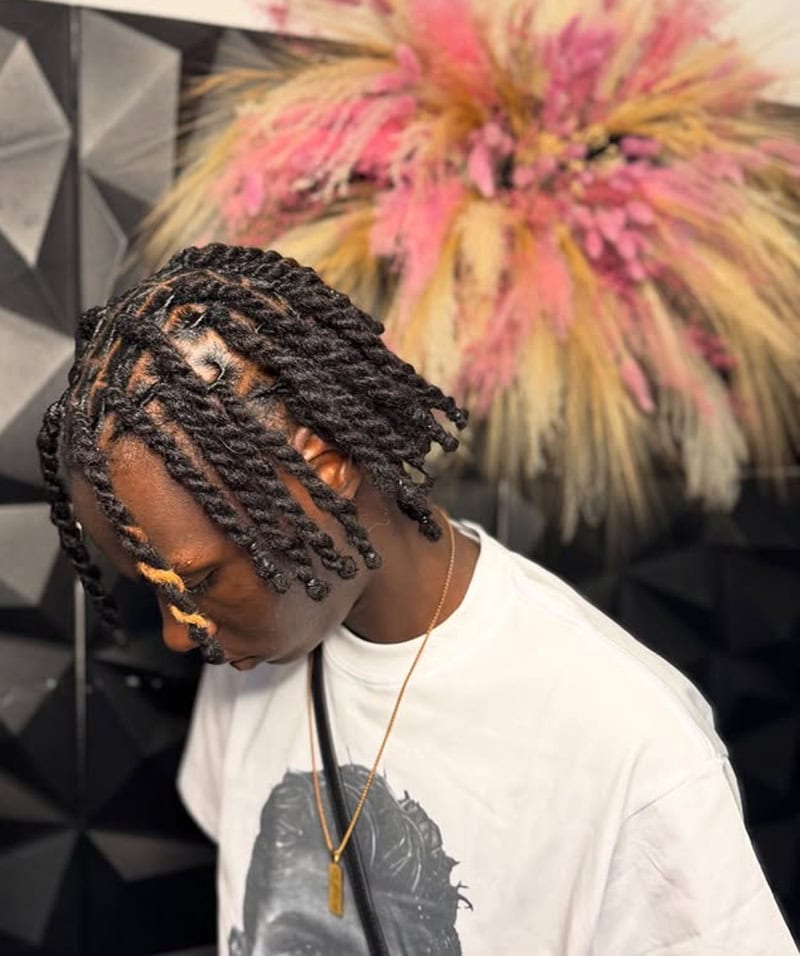 Black boy with shoulder-length twisted dreadlocks