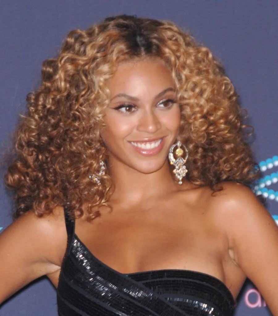 black female celebrity Beyoncé Knowles with curly hair