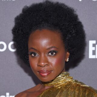 black female celebrity Danai Gurira with curly hair