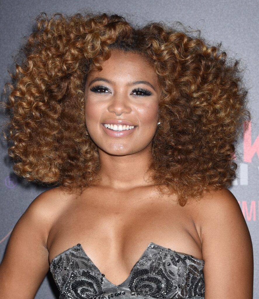 black female celebrity Jaz Sinclair with curly hair