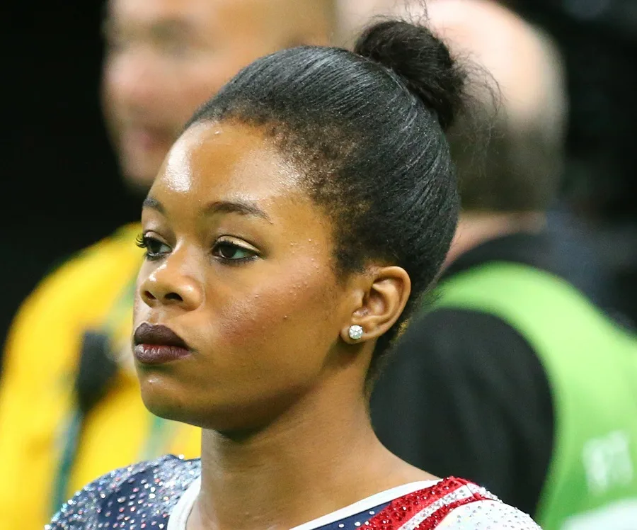 black female gymnast with bun hairstyle