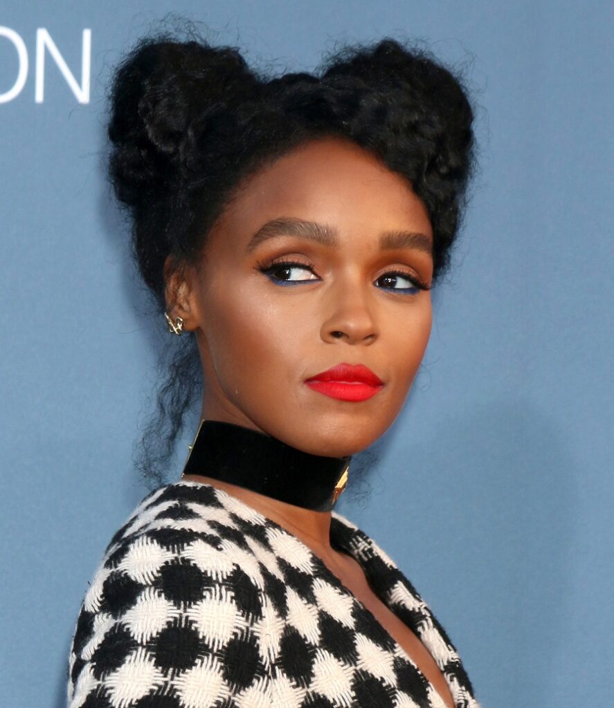 black female singer Janelle Monae with curly hair