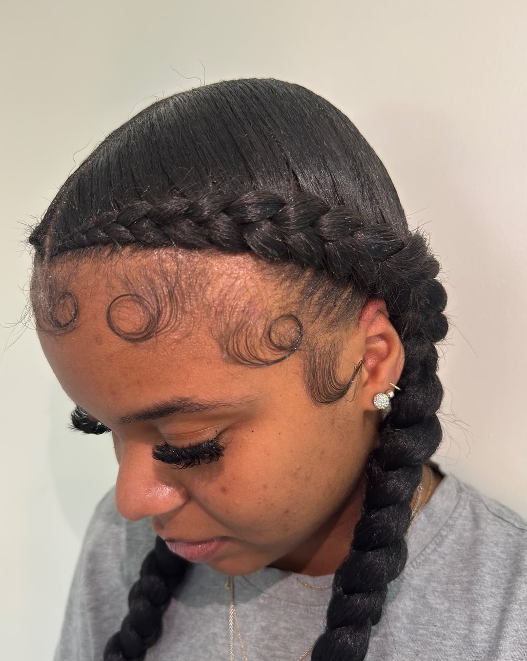 sleek feed-in pigtail braids for black girls
