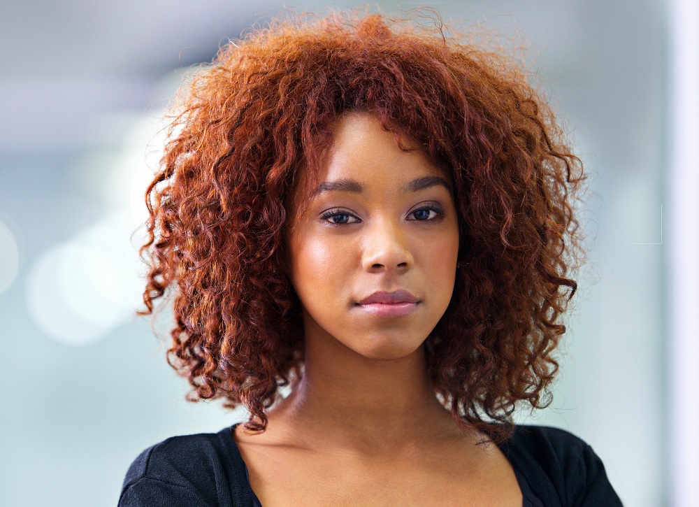 black girl with medium ginger curls