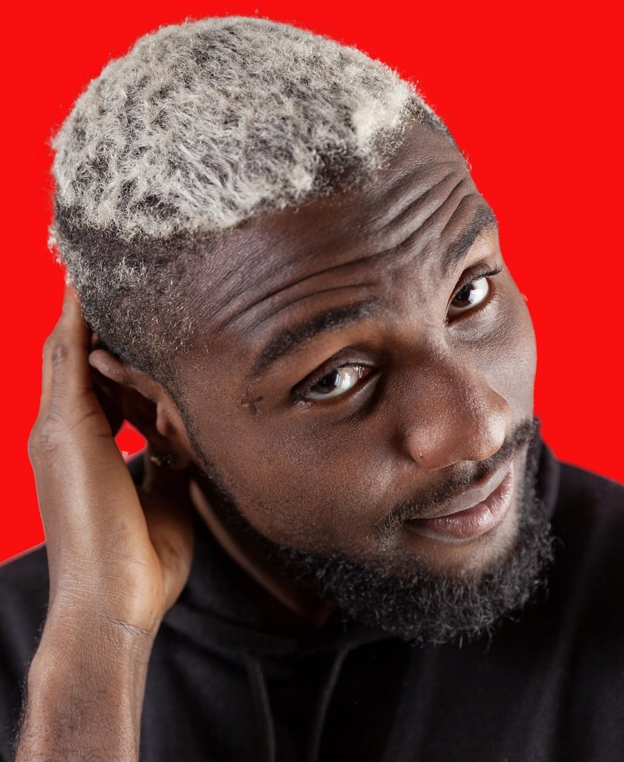 A black guy with silver hair