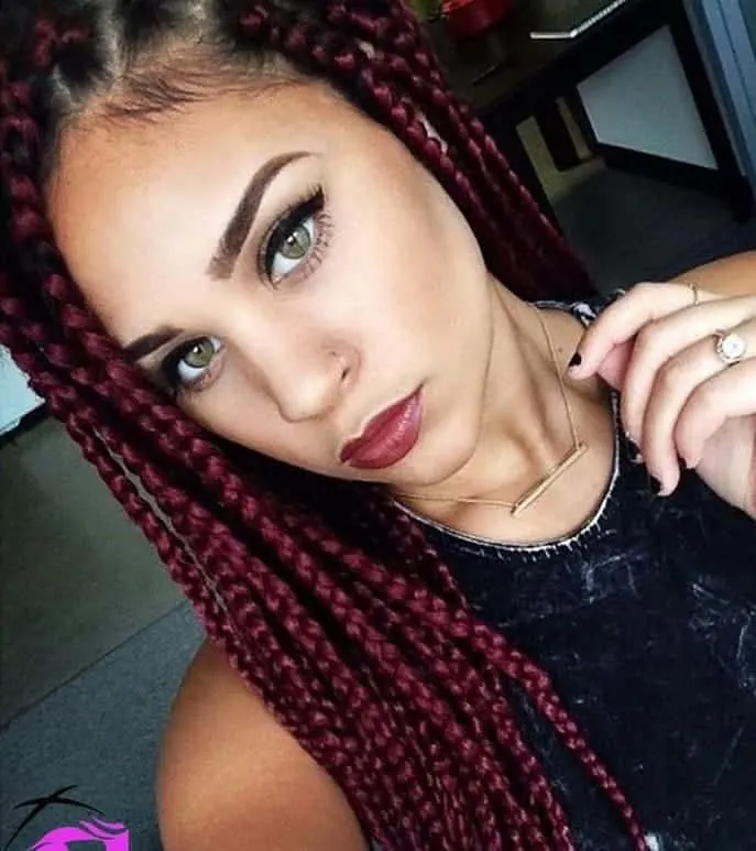 girl with box braids and green eyes