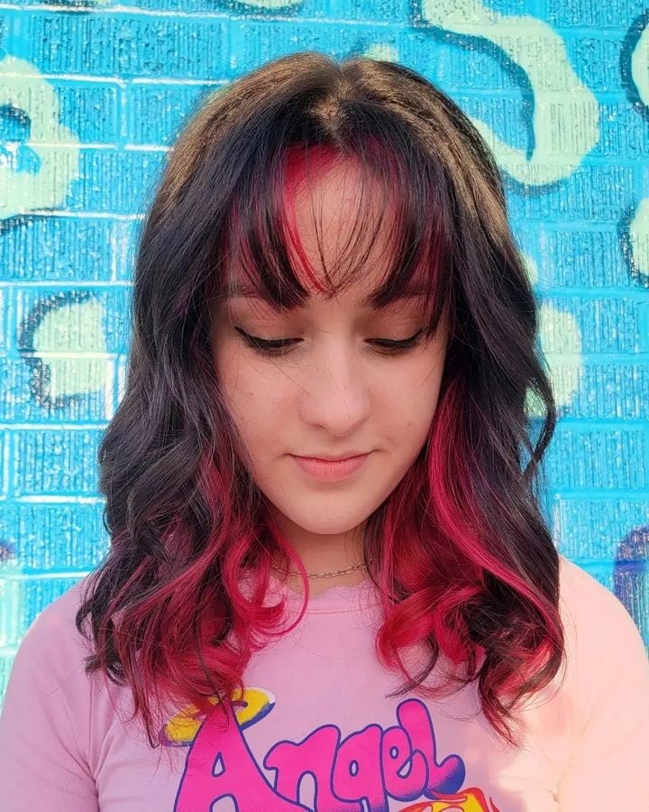 black hair with bangs and pink underneath