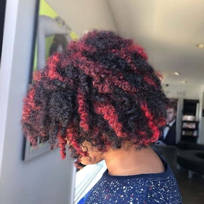 red highlights on curly black hair