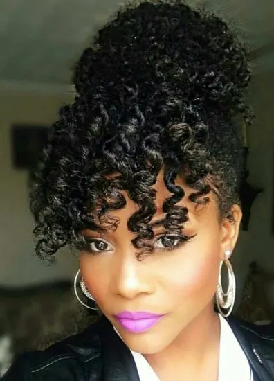 updo hairstyle with curly bangs