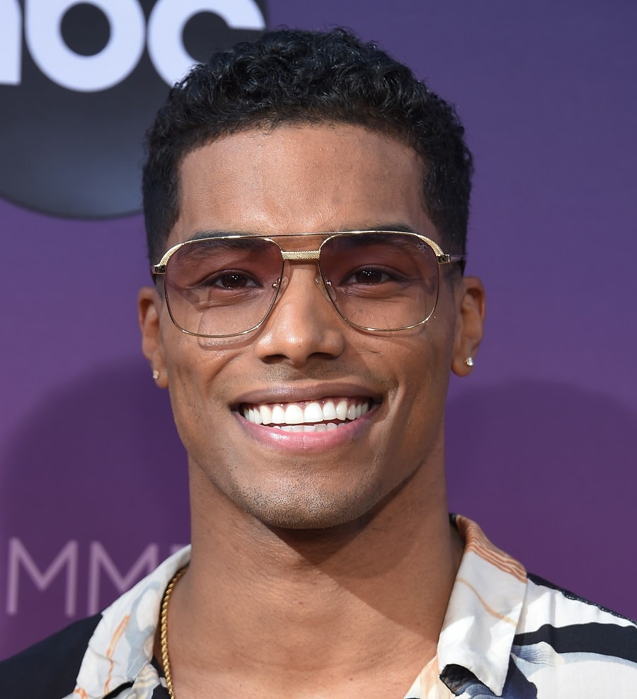 black male celebrity with curly hair-Rome Flynn