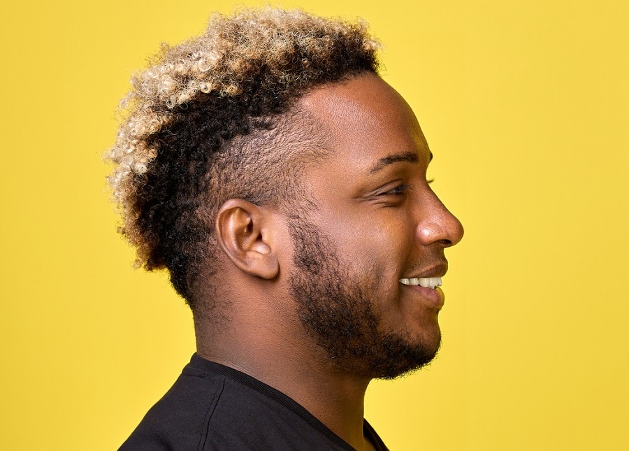 black men's curly dark hair with fade and blonde highlights