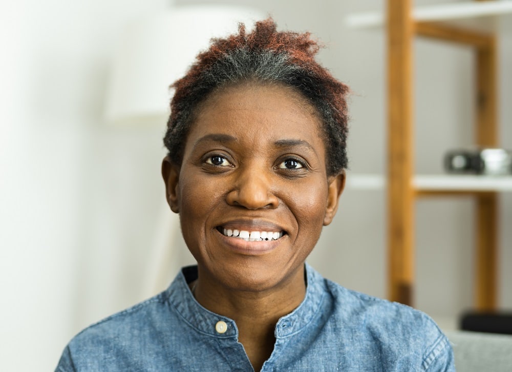 black woman over 50 with highlighted short hair