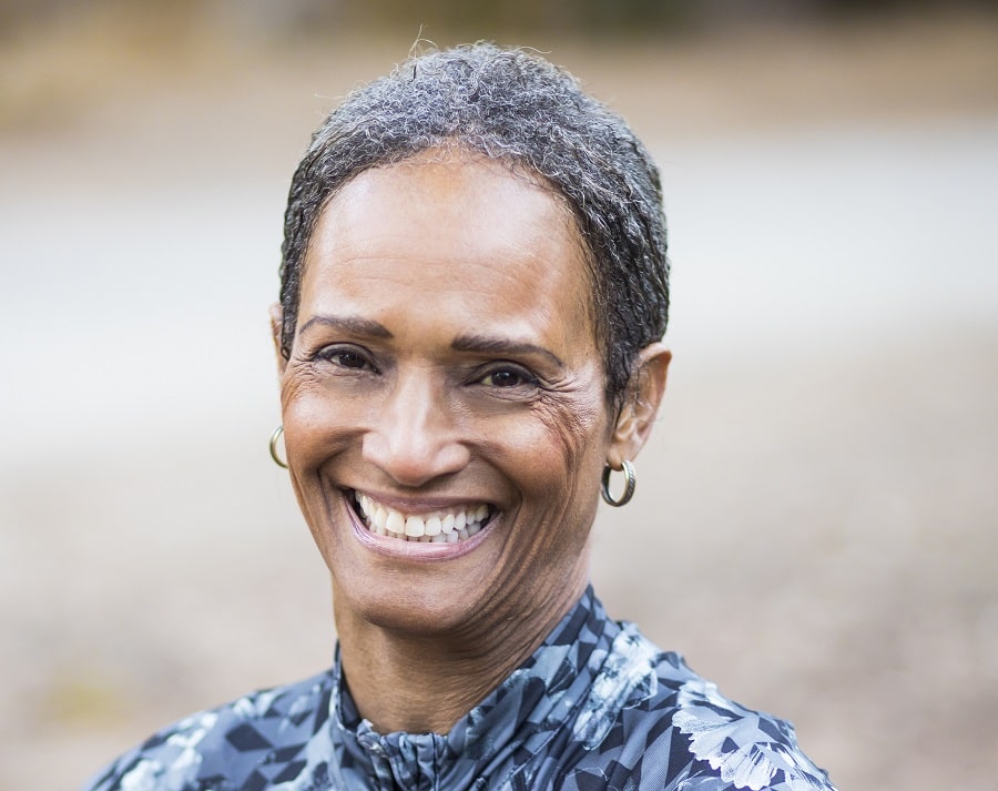 black woman over 50 with short grey hair