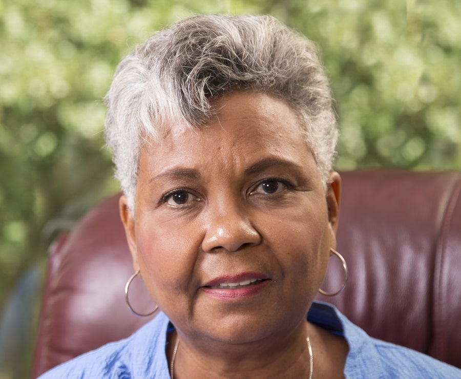 black woman over 60 with short grey hair