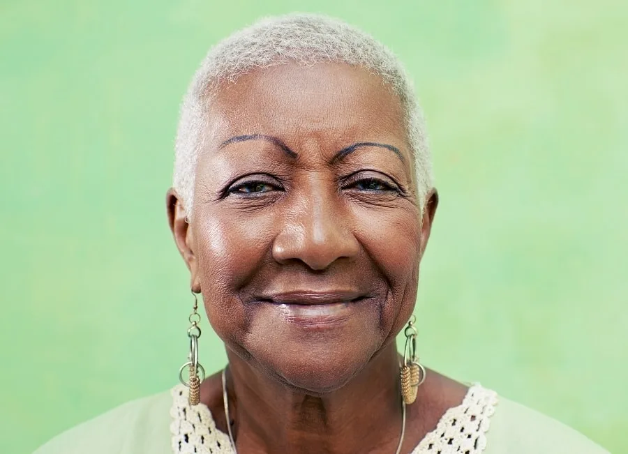 black woman over 70 with short afro hair
