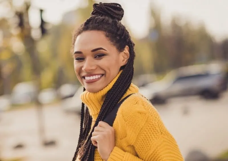 black woman with half up half down braided hairstyle