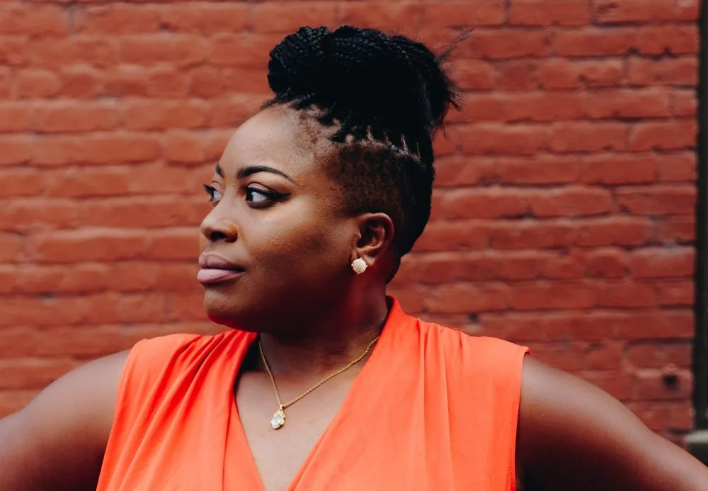 black women's braided updo with shaved sides