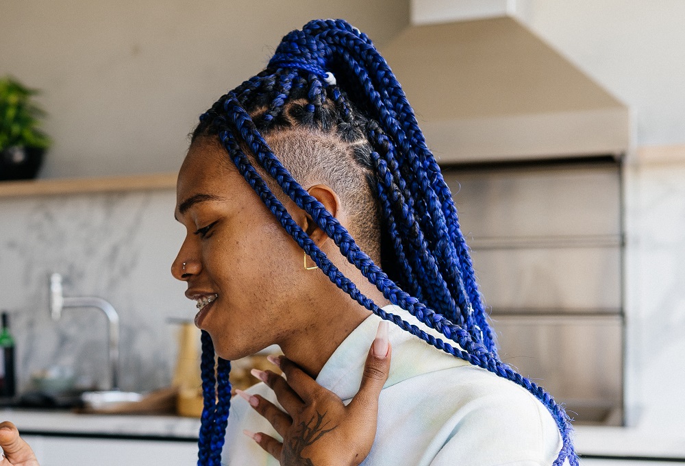 black women's shaved hairstyle with box braids