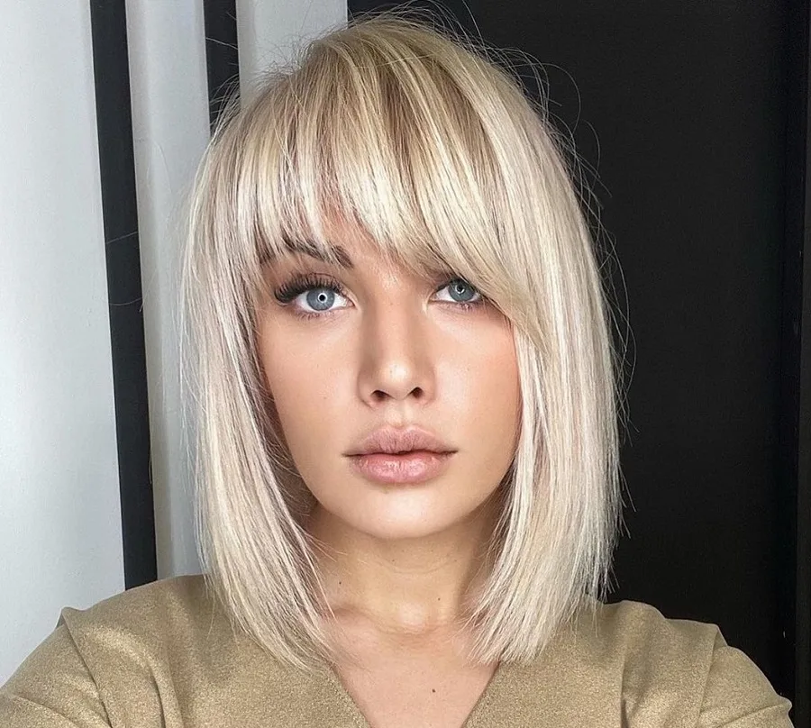 bleach blonde asymmetrical bangs